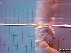 super-cute redhead plays nude underwater